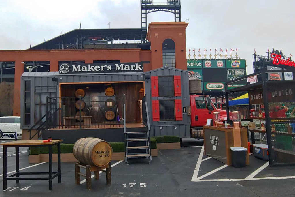 Makers Mark truck built by Turtle Transit parked outside of a baseball field
